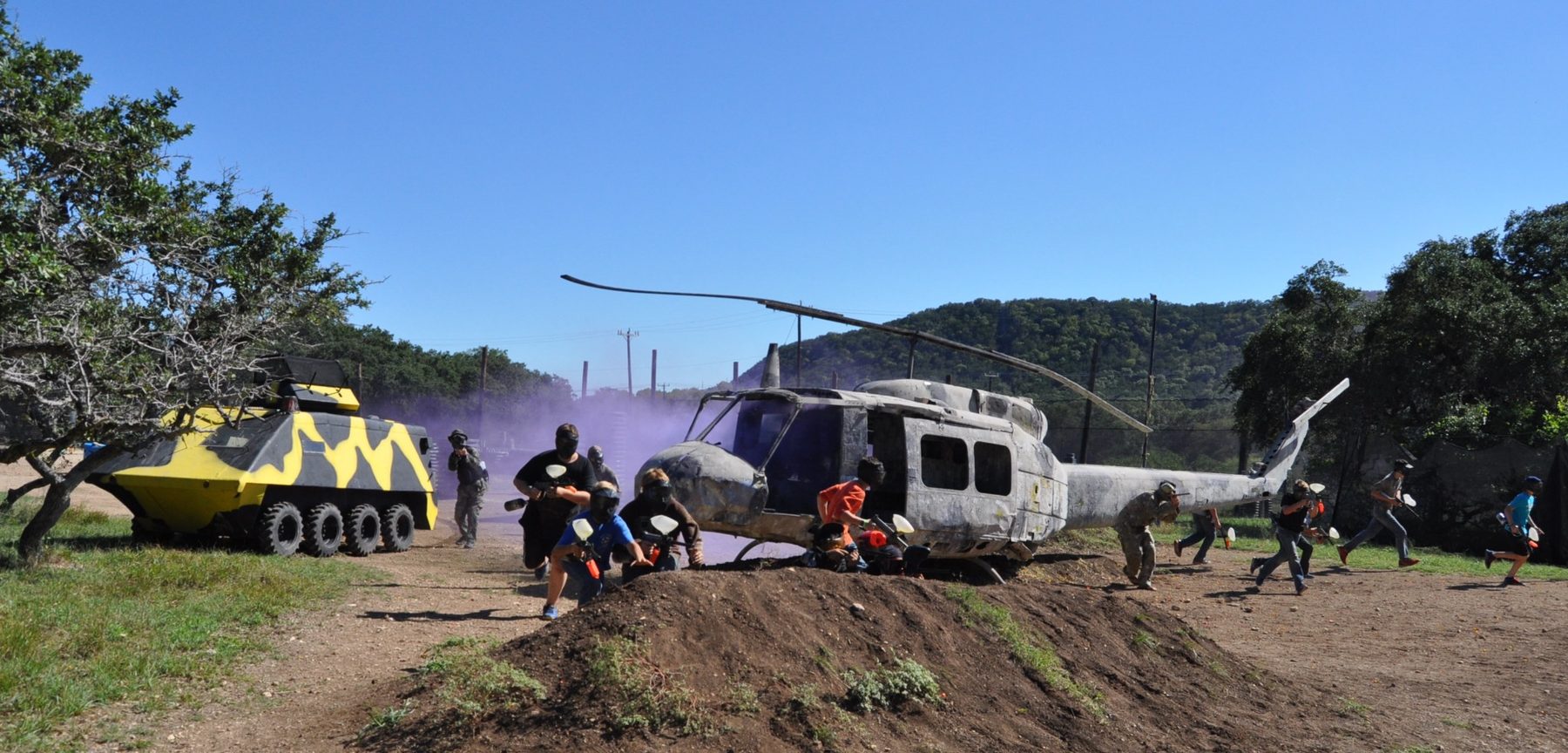Wide view of the Predator Paintball field with players and field structures