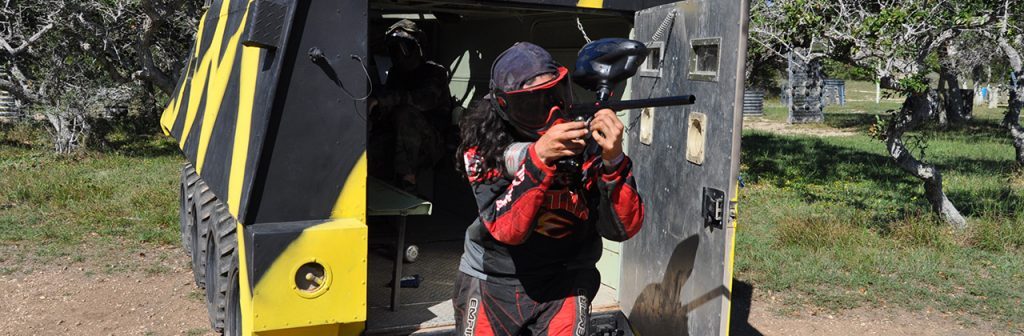 Player taking cover beside a tank obstacle